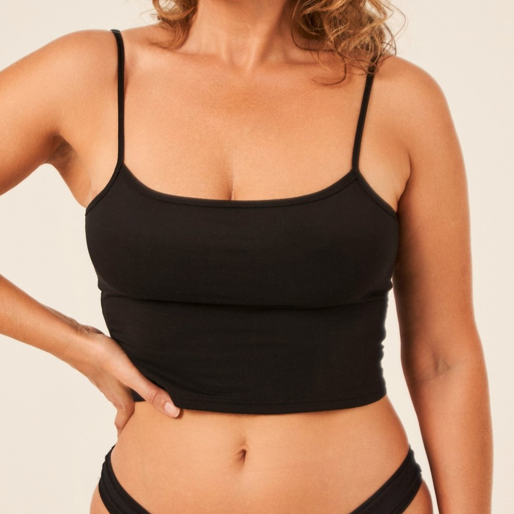 Model wearing black TENCEL short camisole