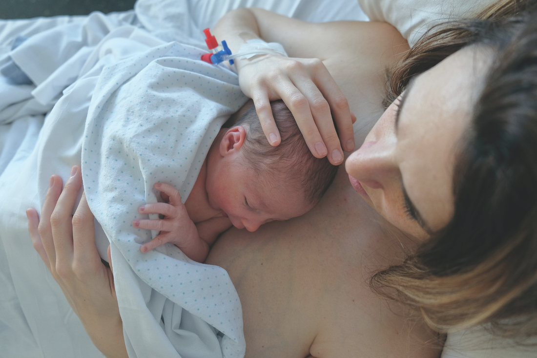 Woman and a child after giving birth