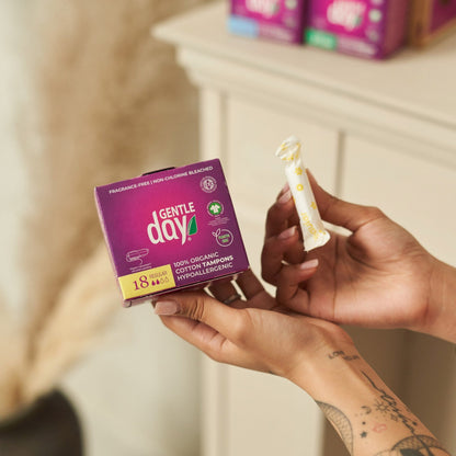 Person holding a tampon box